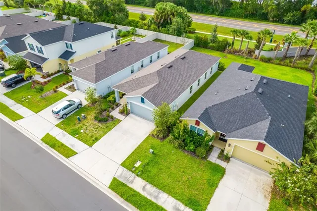 an aerial view of a table and chairs in the patio