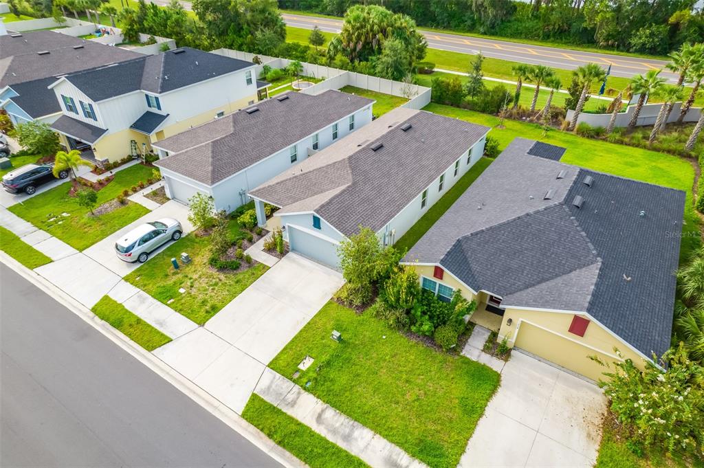 11230 High Noon Trail Parrish, FL 34219 - Photo 32 of 40 an aerial view of a house with a garden and swimming pool