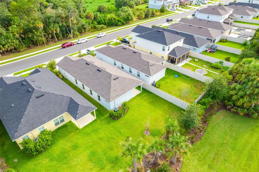 11230 High Noon Trail Parrish, FL 34219 - Photo 33 of 40 an aerial view of a house with a swimming pool yard and outdoor seating