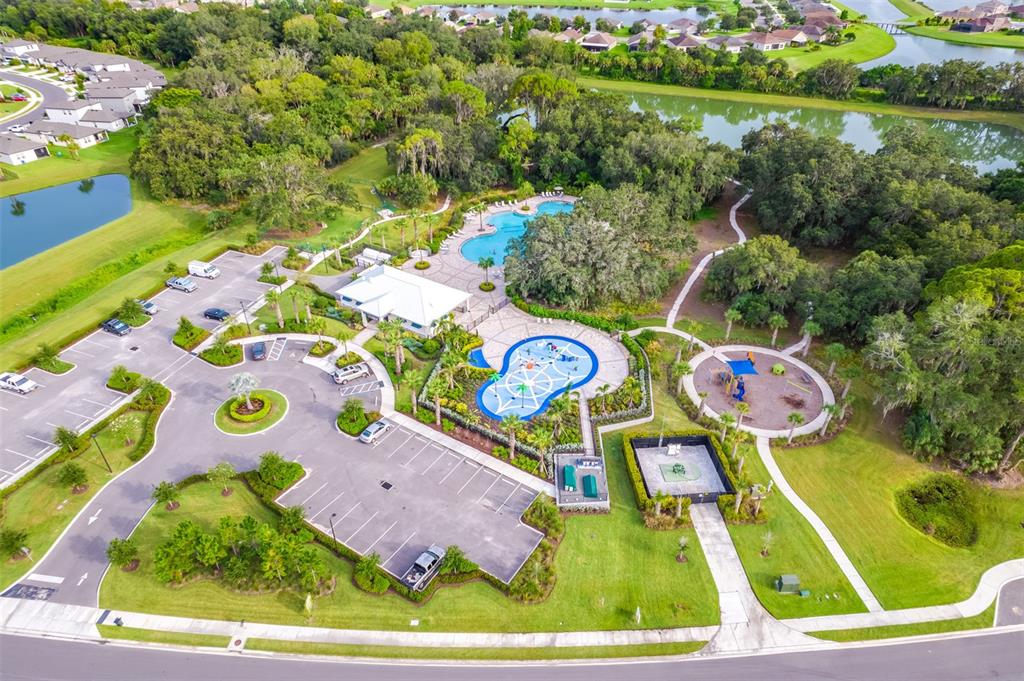 11230 High Noon Trail Parrish, FL 34219 - Photo 34 of 40 an aerial view of a wooden play house with a yard