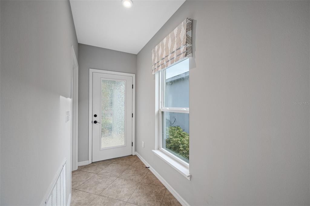 11230 High Noon Trail Parrish, FL 34219 - Photo 4 of 40 a view of hallway with window and front door