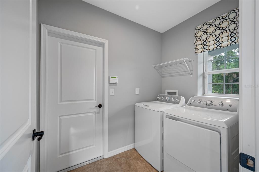 11230 High Noon Trail Parrish, FL 34219 - Photo 5 of 40 a utility room with dryer and washer