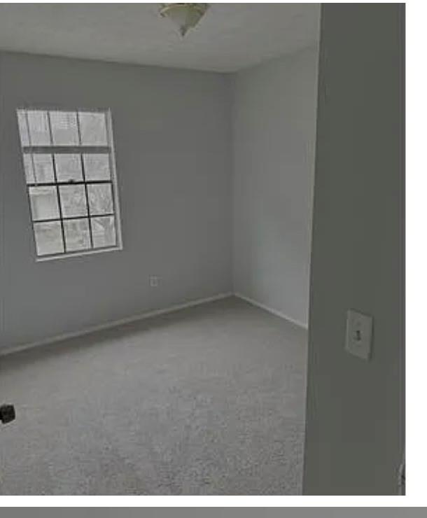 2305 Pine Tree Trail Atlanta, GA 30349 - Photo 12 of 12 an empty room with windows