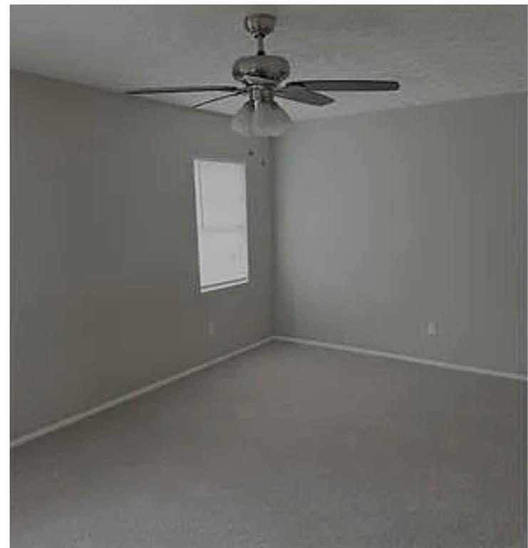 2305 Pine Tree Trail Atlanta, GA 30349 - Photo 7 of 12 a view of a small space with a fan and a window