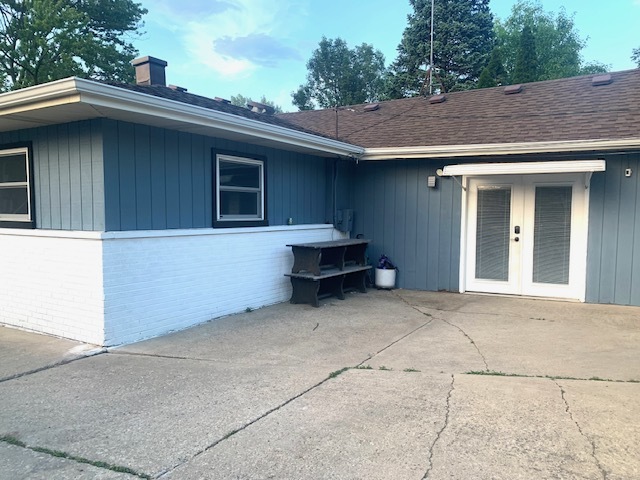 653 South Wayne Place Wheeling, IL 60090 - Photo 14 of 14 a view of a house with a backyard and a garage