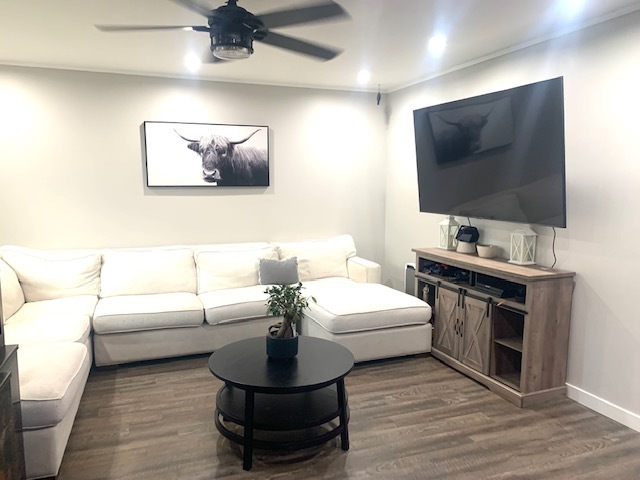 653 South Wayne Place Wheeling, IL 60090 - Photo 3 of 14 a living room with furniture and a flat screen tv