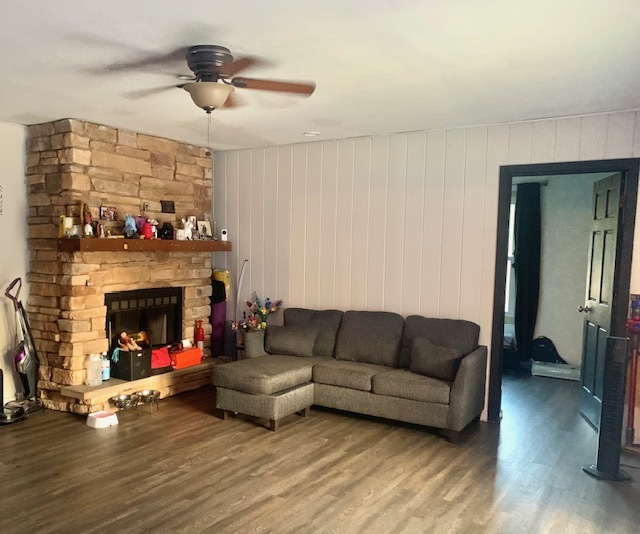653 South Wayne Place Wheeling, IL 60090 - Photo 7 of 14 a living room with furniture and a fireplace