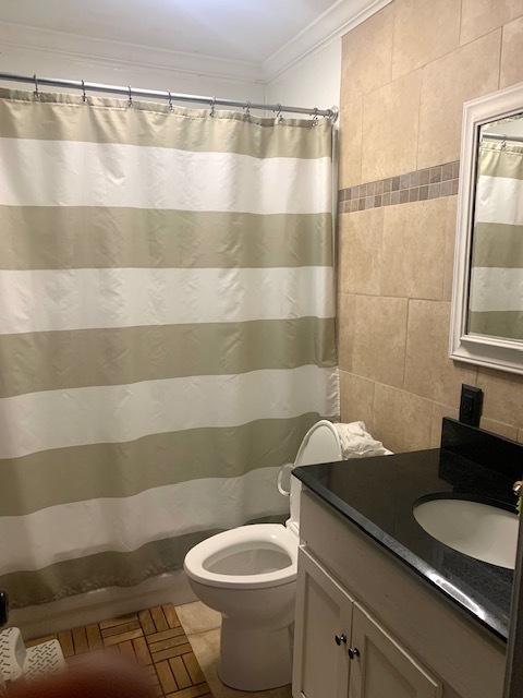 653 South Wayne Place Wheeling, IL 60090 - Photo 9 of 14 a bathroom with a sink and a mirror
