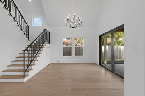 a view of an entryway with wooden floor