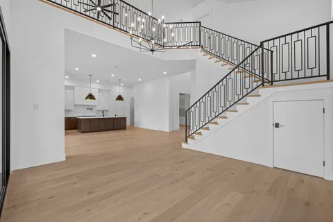 a view of entryway and hall with wooden floor