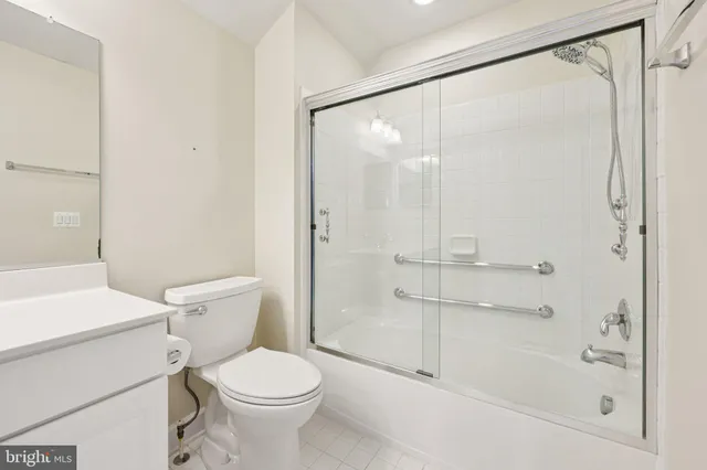 a bathroom with a toilet sink and shower