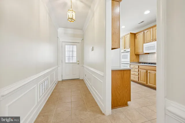 a view of a kitchen from the hallway