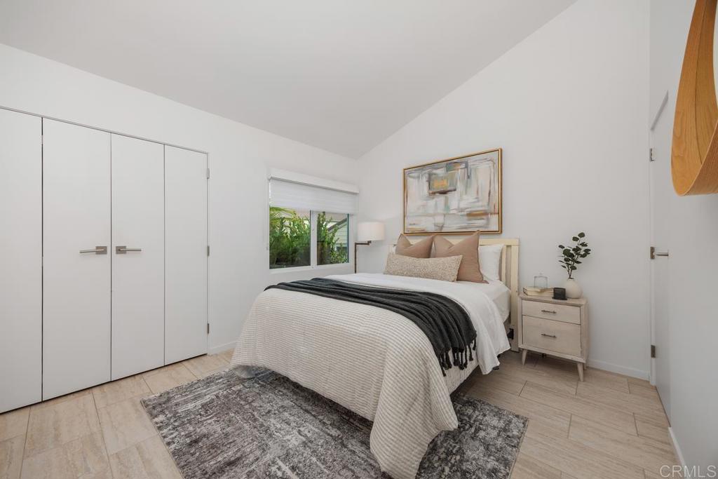 1856 Parliament Road Encinitas, CA 92024 - Photo 31 of 42 a bedroom with a bed and a window