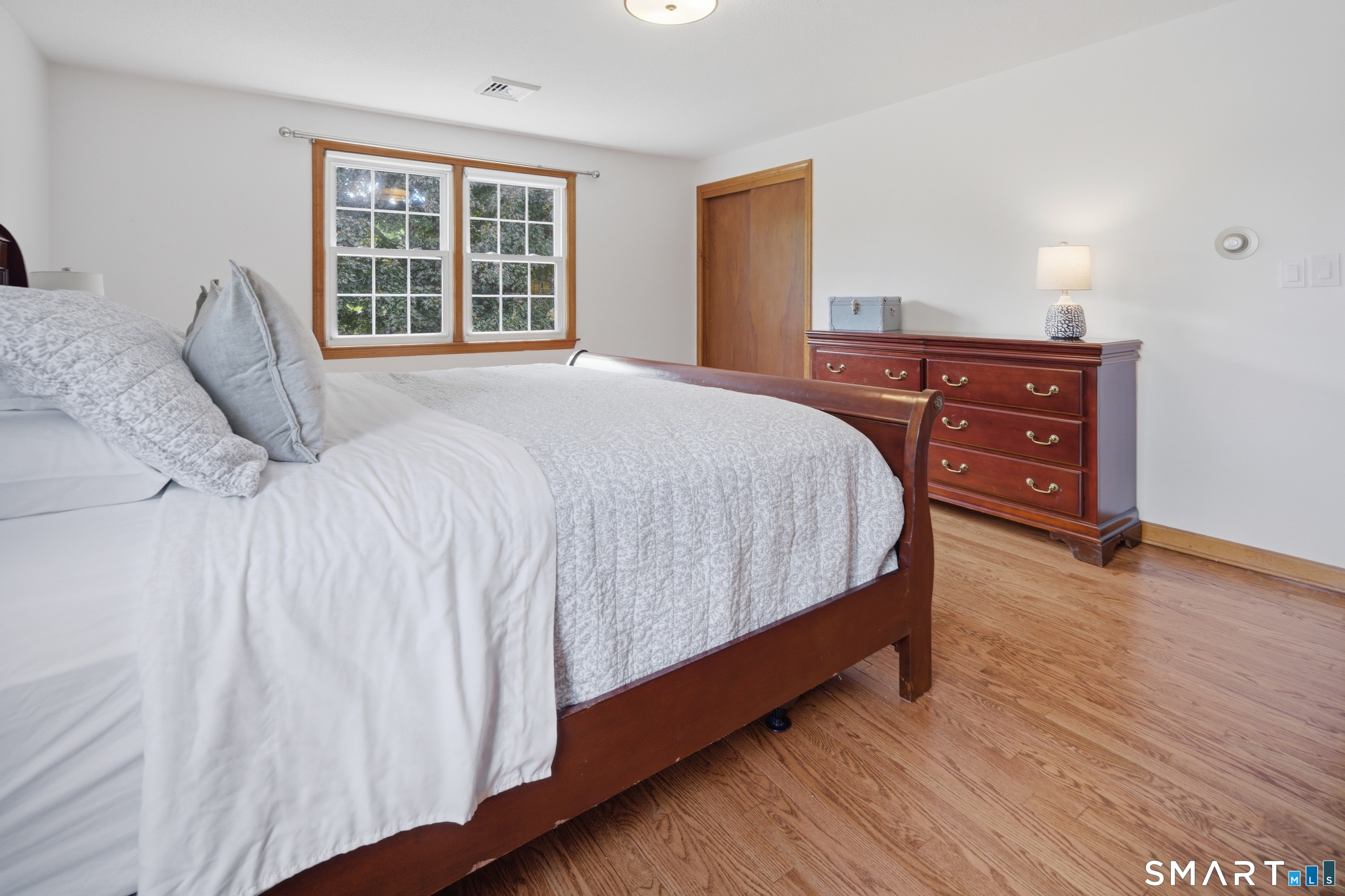 211 Valley View Road Manchester, CT 06040 - Photo 23 of 39 a bedroom with a bed and a dresser