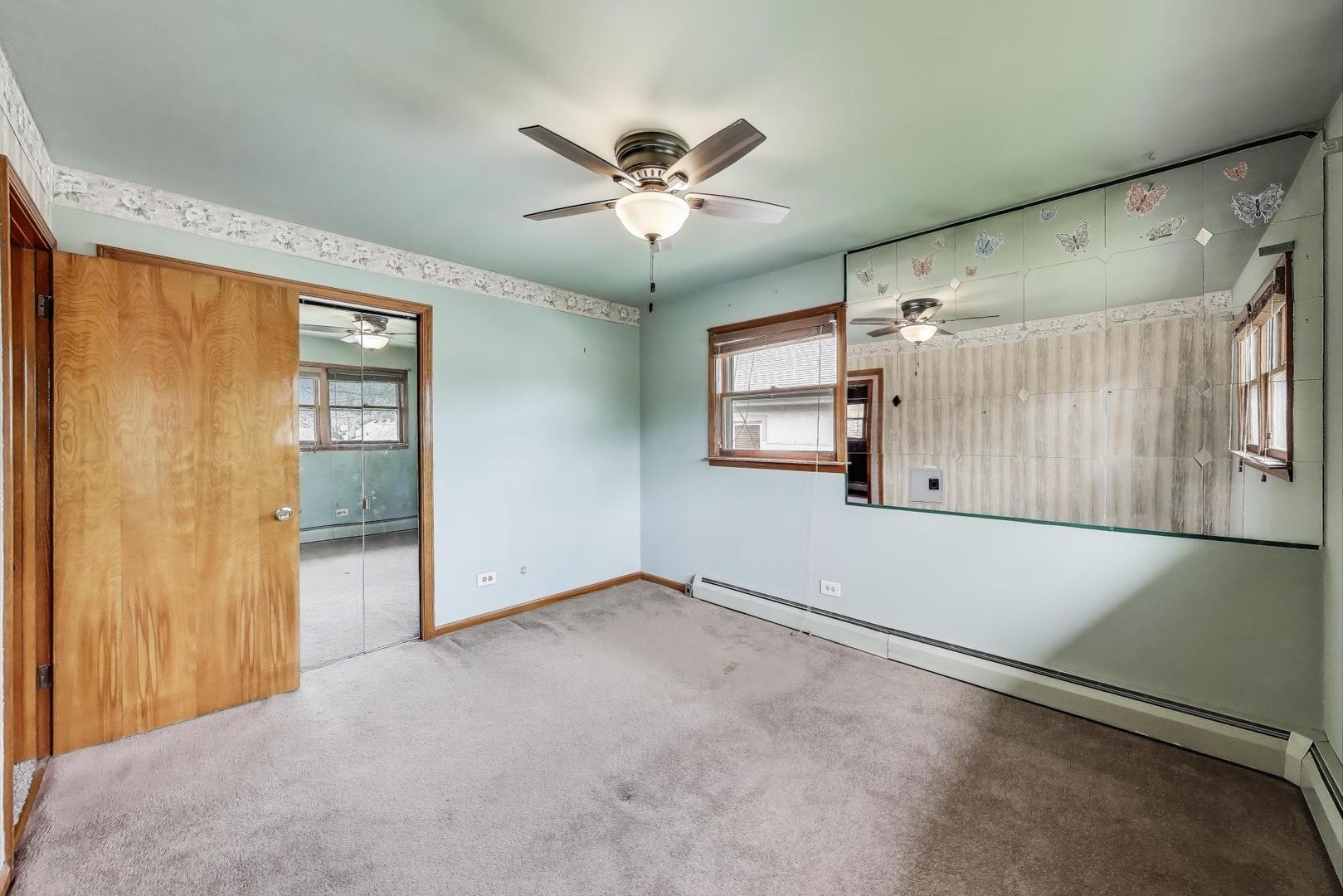 4121 Maple Avenue Lyons, IL 60534 - Photo 13 of 32 a view of a livingroom with a ceiling fan and window