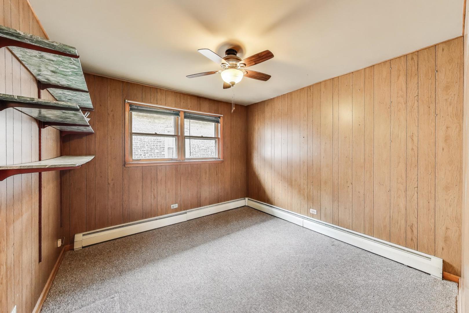 4121 Maple Avenue Lyons, IL 60534 - Photo 15 of 32 an empty room with windows and fan