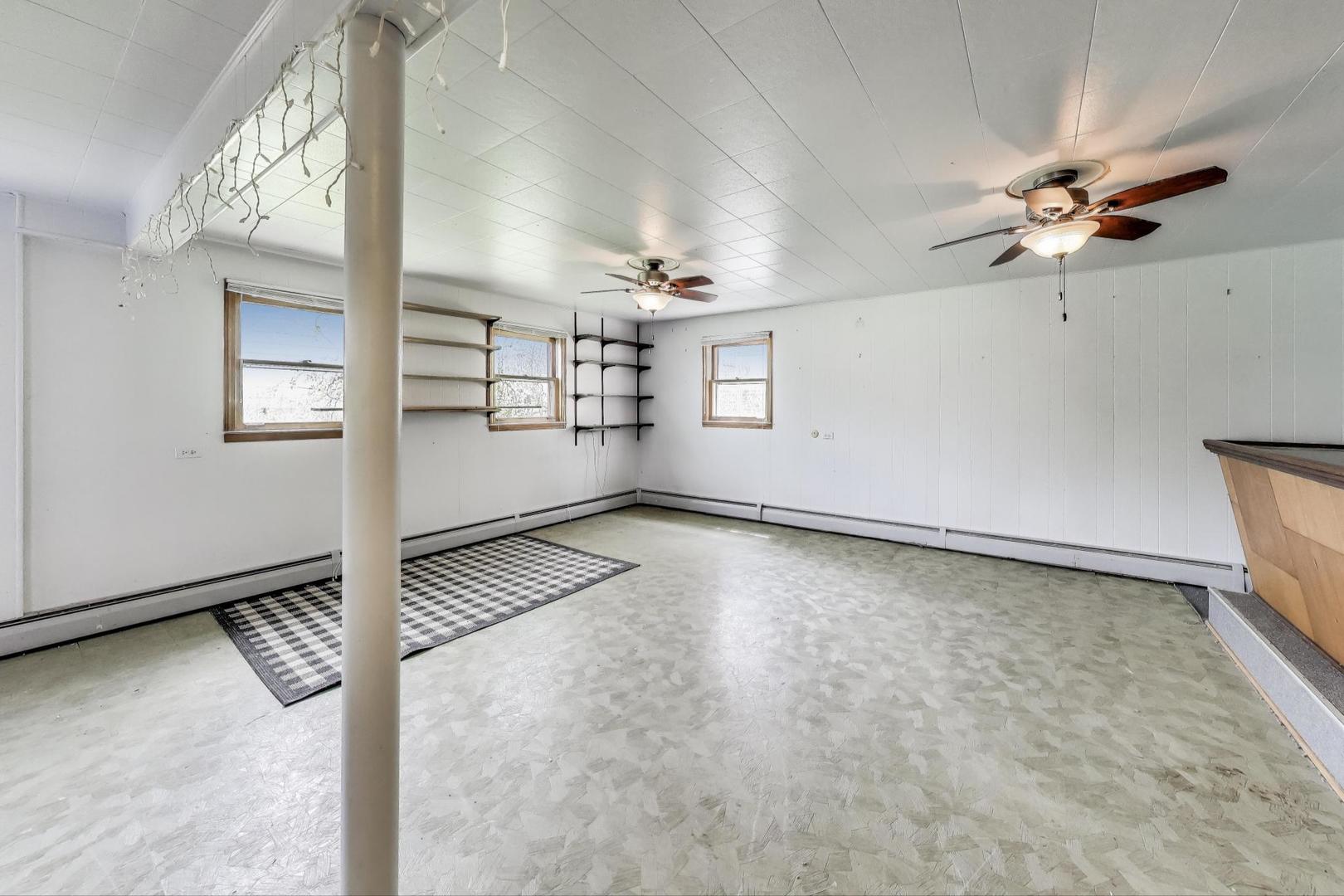 4121 Maple Avenue Lyons, IL 60534 - Photo 20 of 32 wooden floor in an empty room with a window