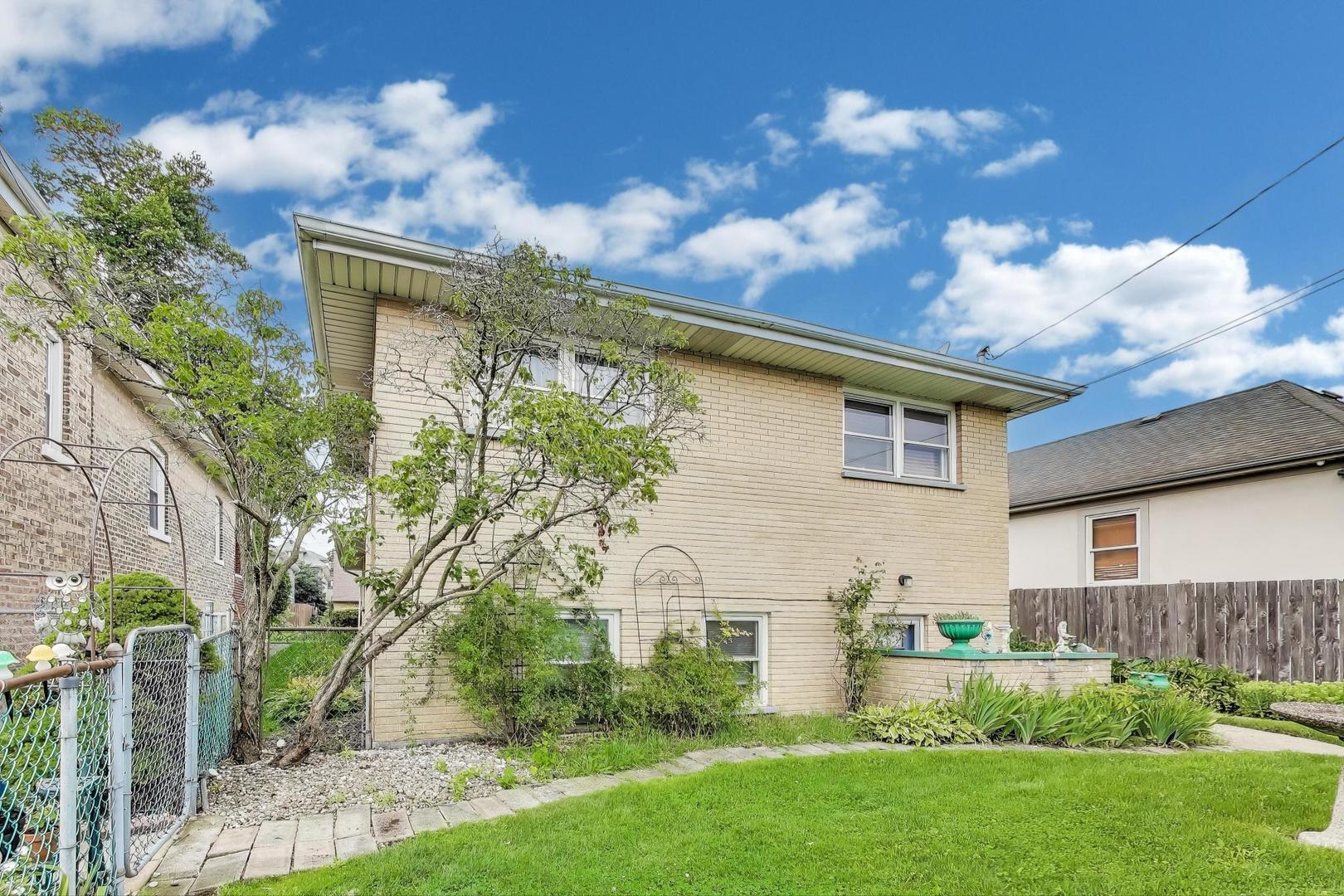 4121 Maple Avenue Lyons, IL 60534 - Photo 26 of 32 a front view of a house with garden