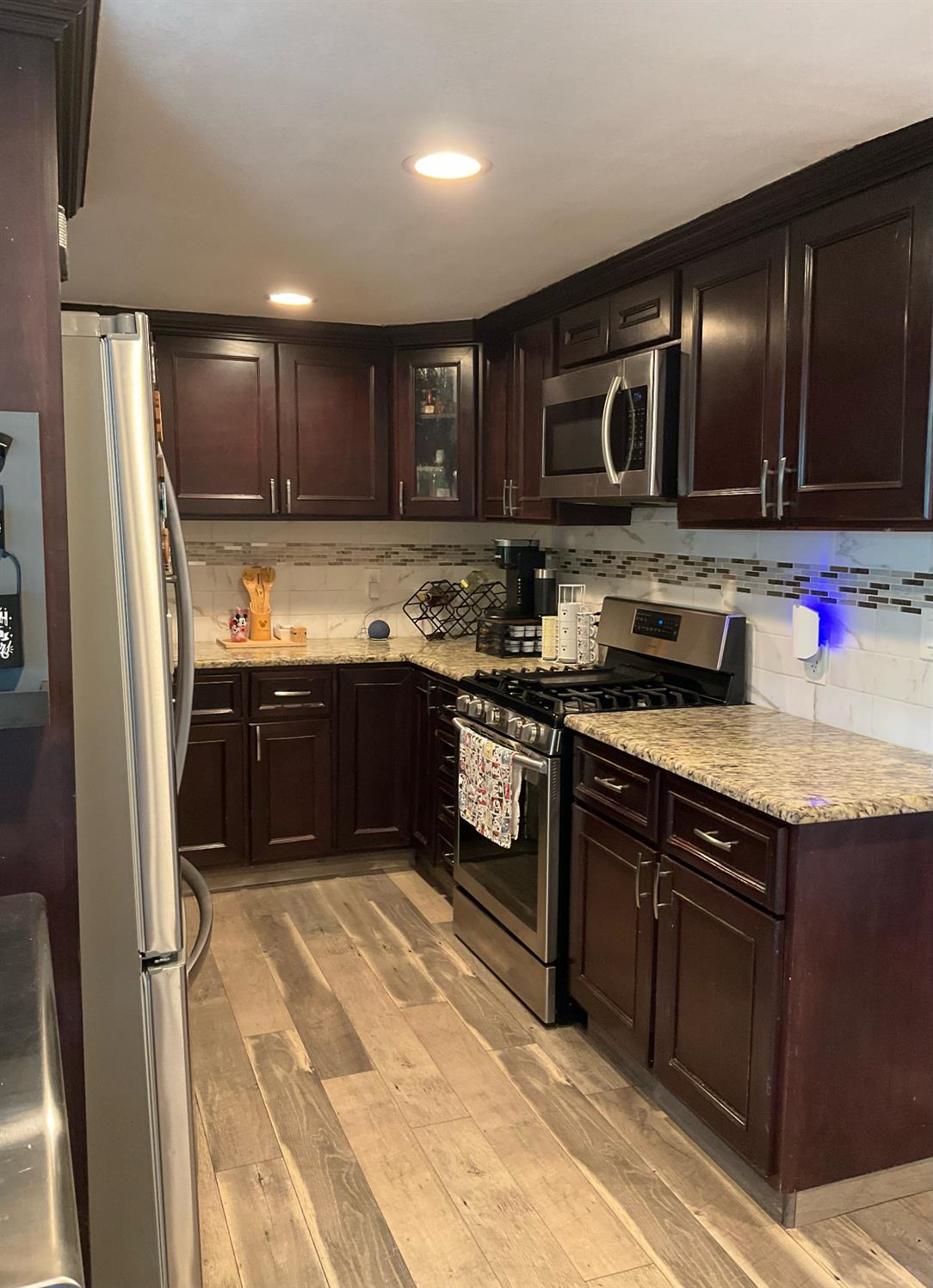 15820 South Harlan Road, Unit 5 Lathrop, CA 95330 - Photo 3 of 18 a kitchen with stainless steel appliances granite countertop a sink stove and refrigerator