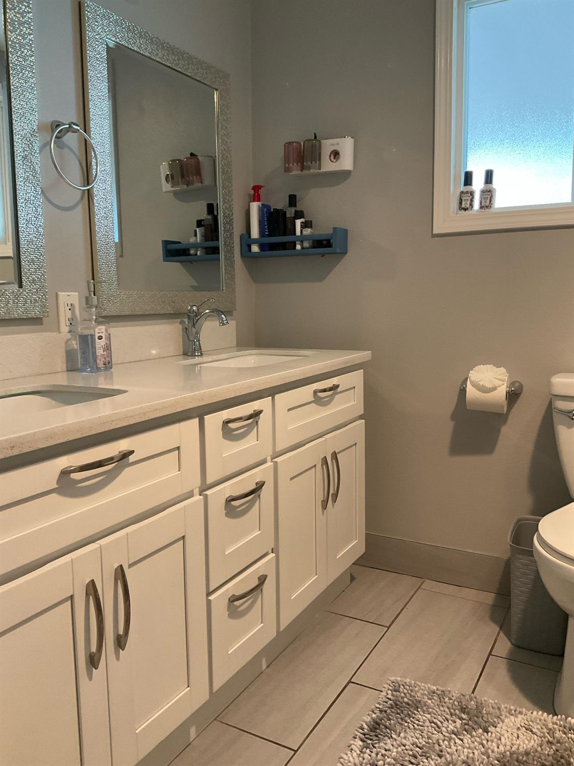 15820 South Harlan Road, Unit 5 Lathrop, CA 95330 - Photo 8 of 18 a bathroom with a sink a toilet and mirror