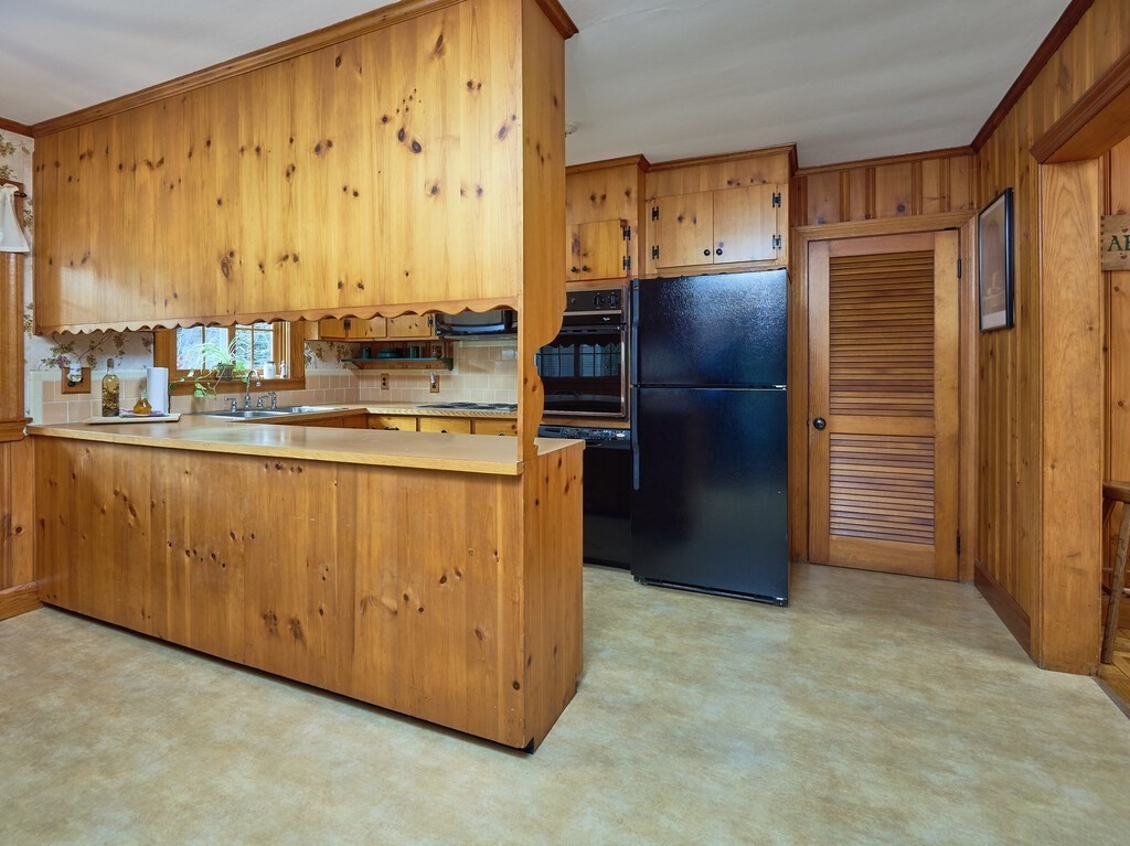 71 Old Common Road Lancaster, MA 01523 - Photo 11 of 39 a kitchen with stainless steel appliances granite countertop a refrigerator and a stove
