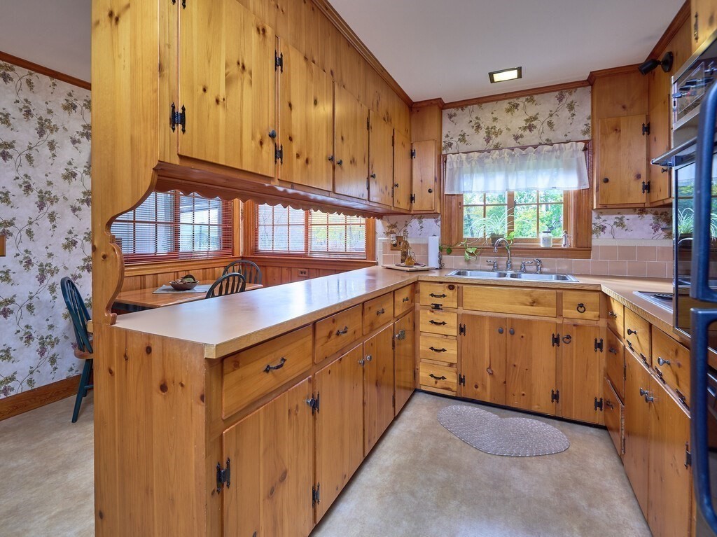 71 Old Common Road Lancaster, MA 01523 - Photo 12 of 39 a kitchen with cabinets a sink and appliances