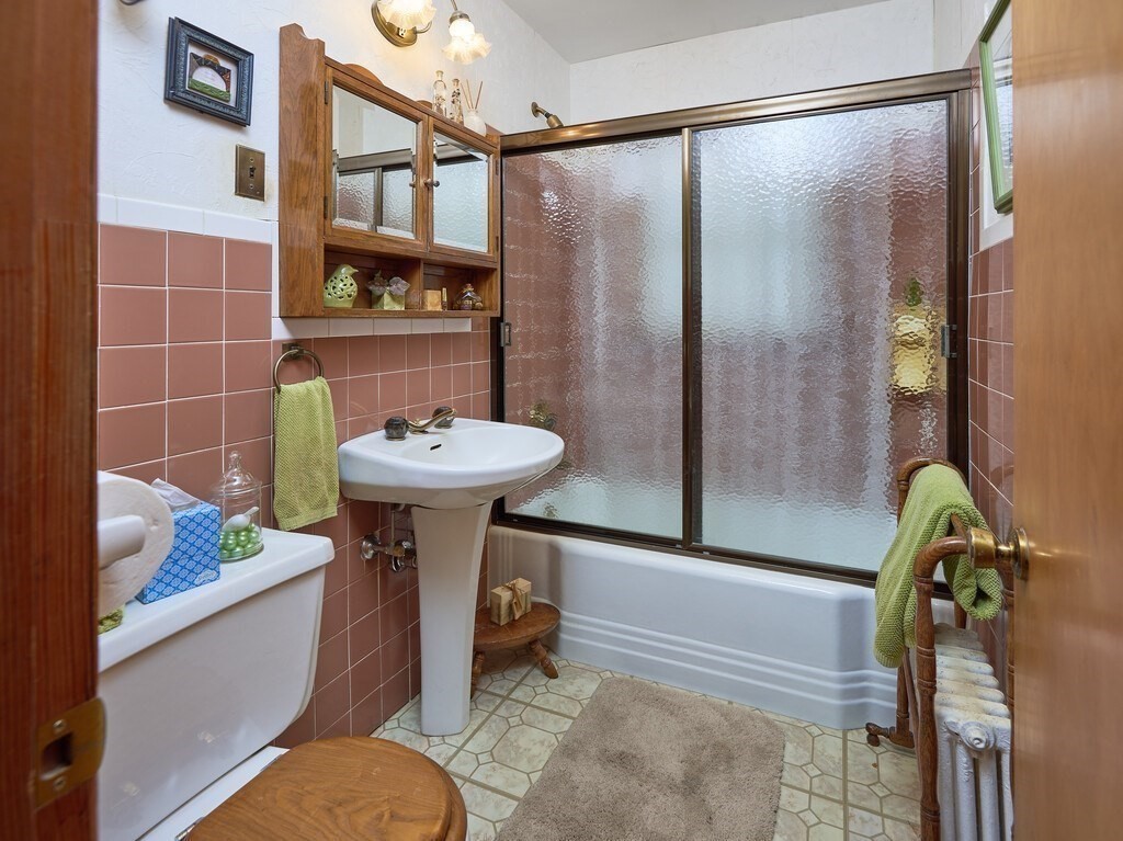 71 Old Common Road Lancaster, MA 01523 - Photo 14 of 39 a bathroom with a sink toilet and shower