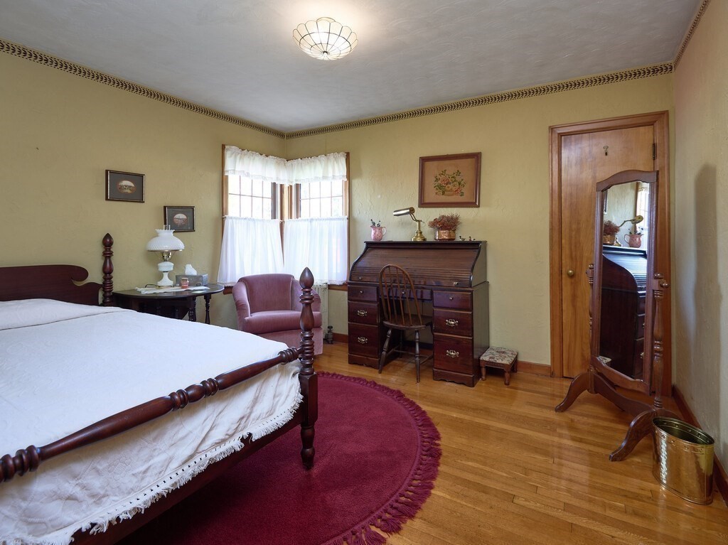 71 Old Common Road Lancaster, MA 01523 - Photo 19 of 39 a bed room with a bed and a chair