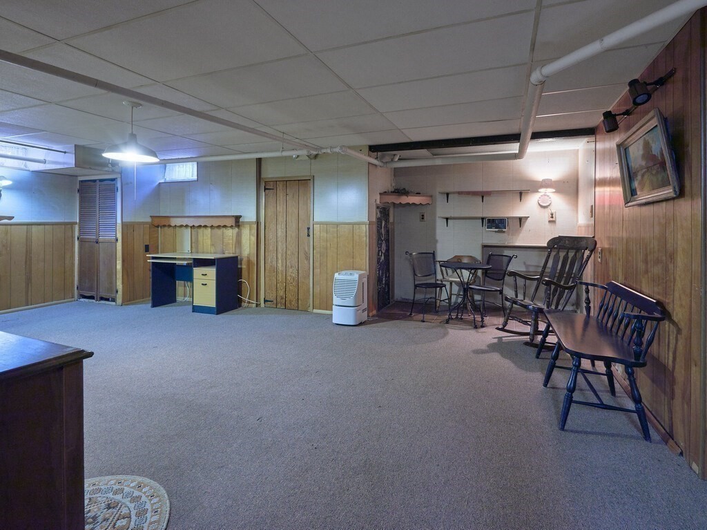 71 Old Common Road Lancaster, MA 01523 - Photo 25 of 39 a view of a livingroom with furniture and a fireplace