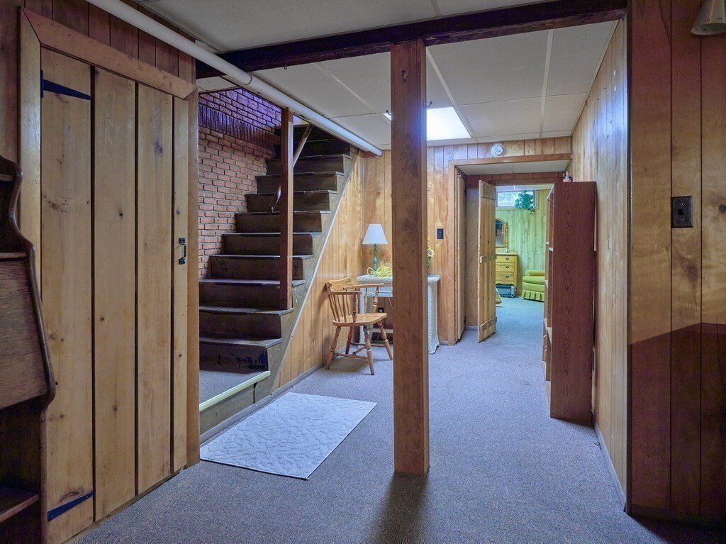 71 Old Common Road Lancaster, MA 01523 - Photo 26 of 39 a view of hallway with stairs and furniture