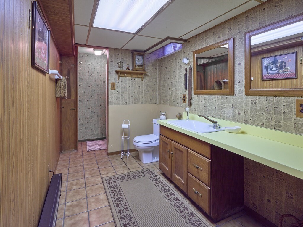 71 Old Common Road Lancaster, MA 01523 - Photo 27 of 39 a spacious bathroom with a double vanity sink mirror double and toilet