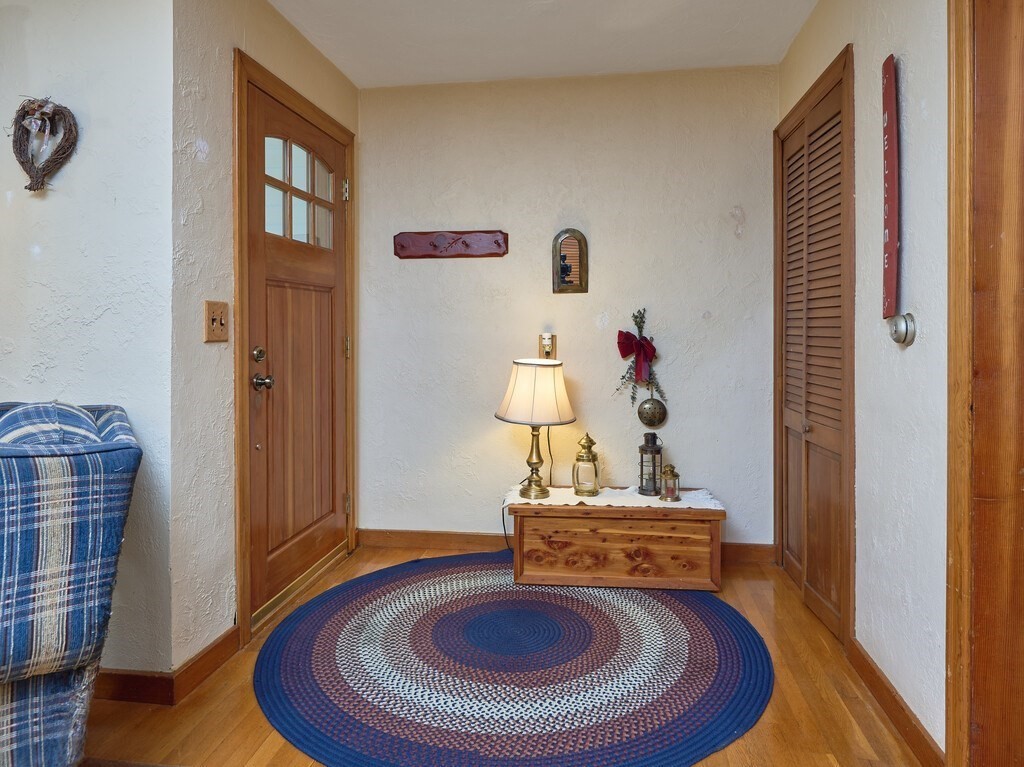 71 Old Common Road Lancaster, MA 01523 - Photo 3 of 39 a room with furniture and a wooden floor