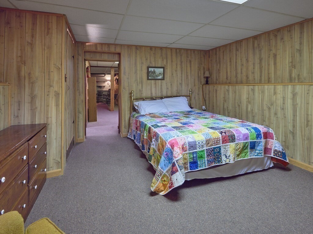 71 Old Common Road Lancaster, MA 01523 - Photo 31 of 39 a bedroom with a bed and a cabinets