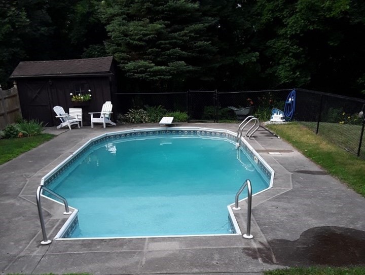 71 Old Common Road Lancaster, MA 01523 - Photo 39 of 39 a view of a swimming pool with a yard and sitting area