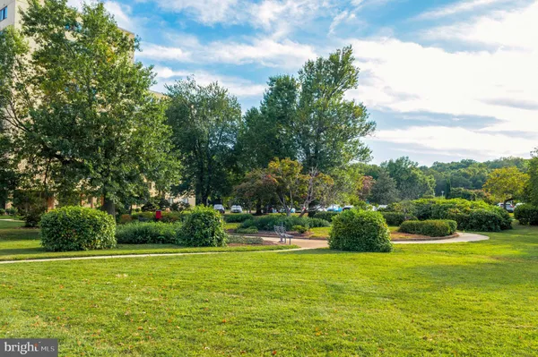 a view of a garden with houses
