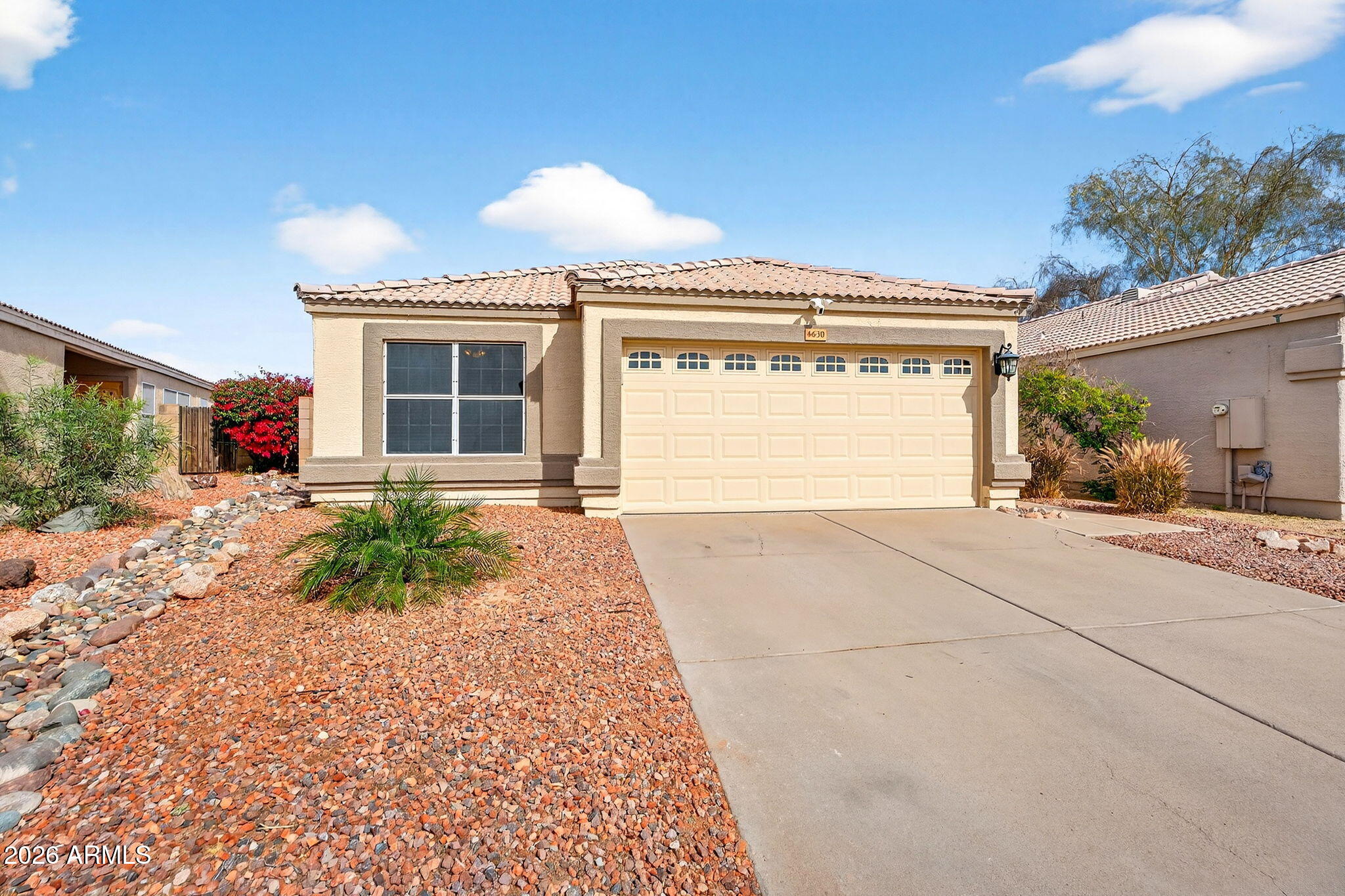 4630 East Dry Creek Road Phoenix, AZ 85044 - Photo 1 of 60 a front view of a house with garden