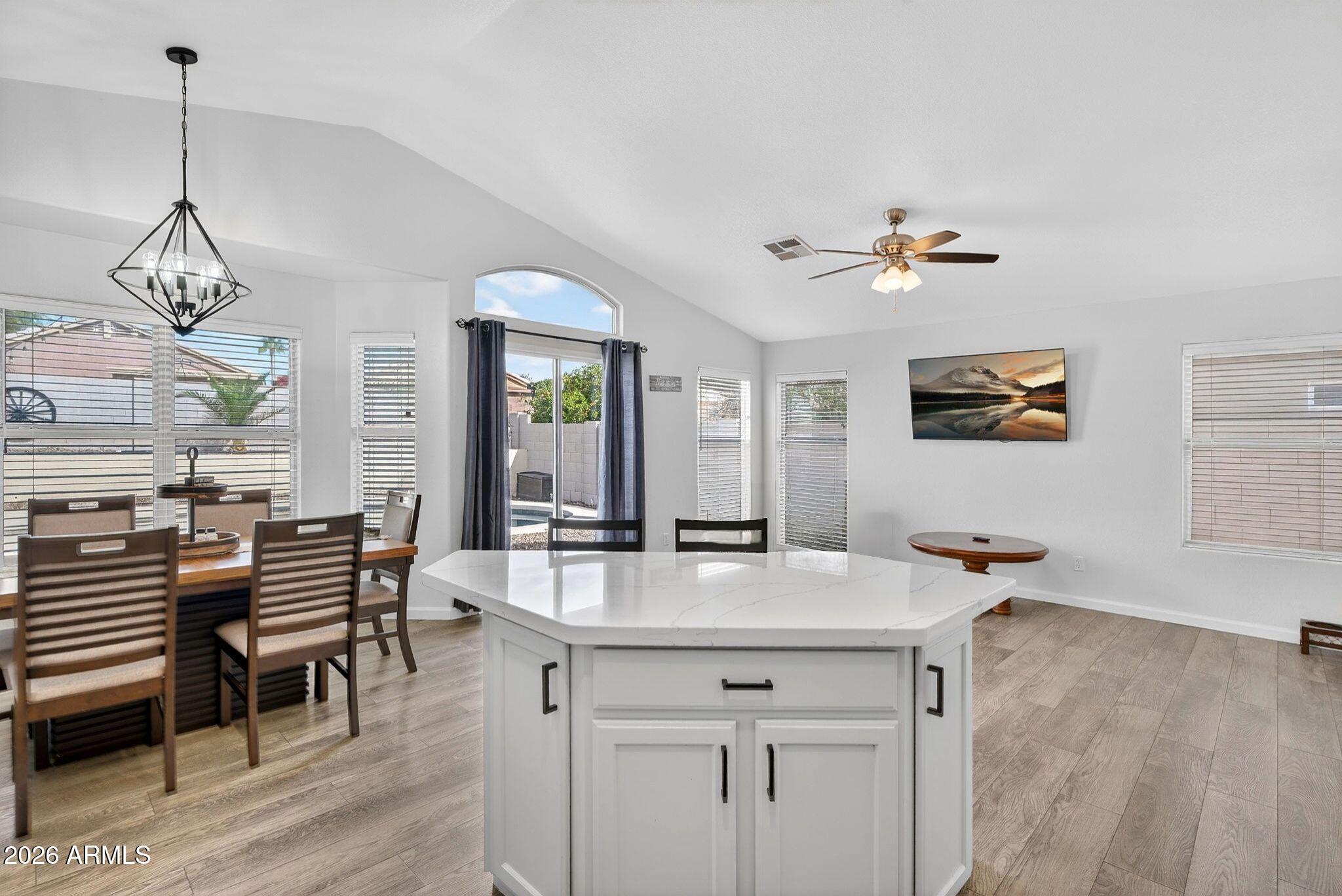 4630 East Dry Creek Road Phoenix, AZ 85044 - Photo 14 of 60 a dining room with furniture and window