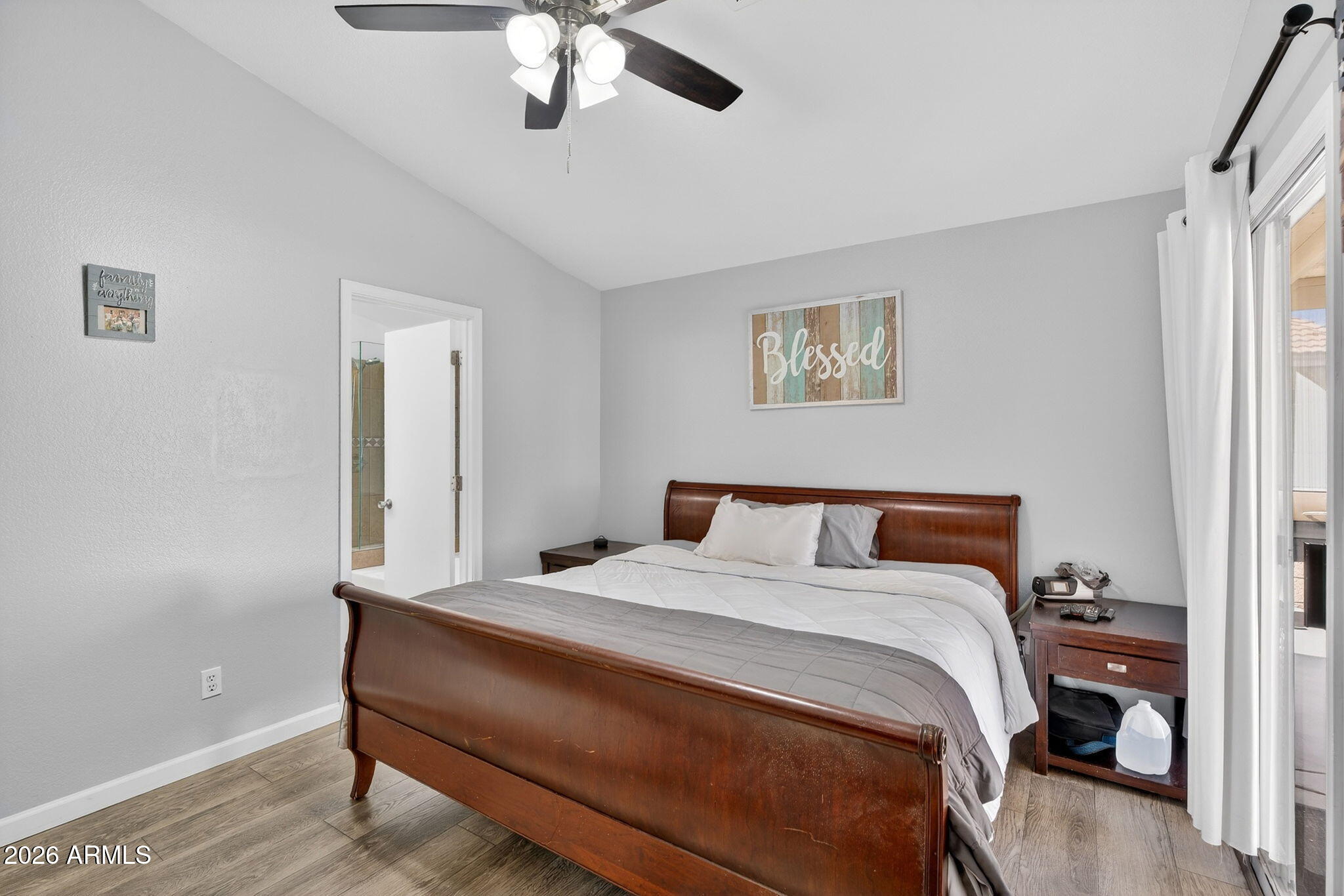 4630 East Dry Creek Road Phoenix, AZ 85044 - Photo 20 of 60 a bed room with a bed and a chandelier