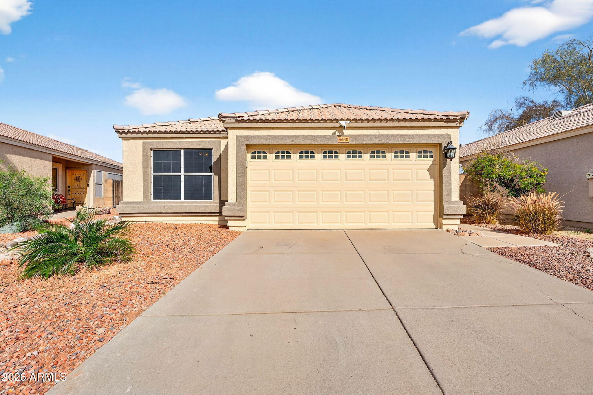 4630 East Dry Creek Road Phoenix, AZ 85044 - Photo 2 of 60 a front view of a house with a yard and potted plants