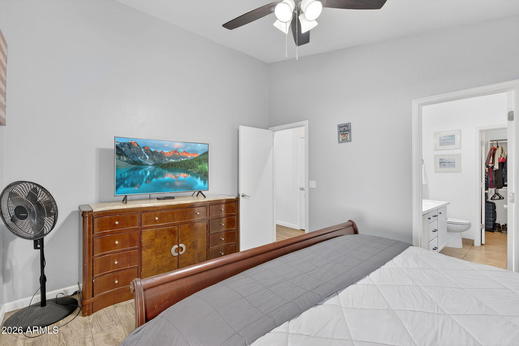 4630 East Dry Creek Road Phoenix, AZ 85044 - Photo 22 of 60 a bedroom with a bed and furniture