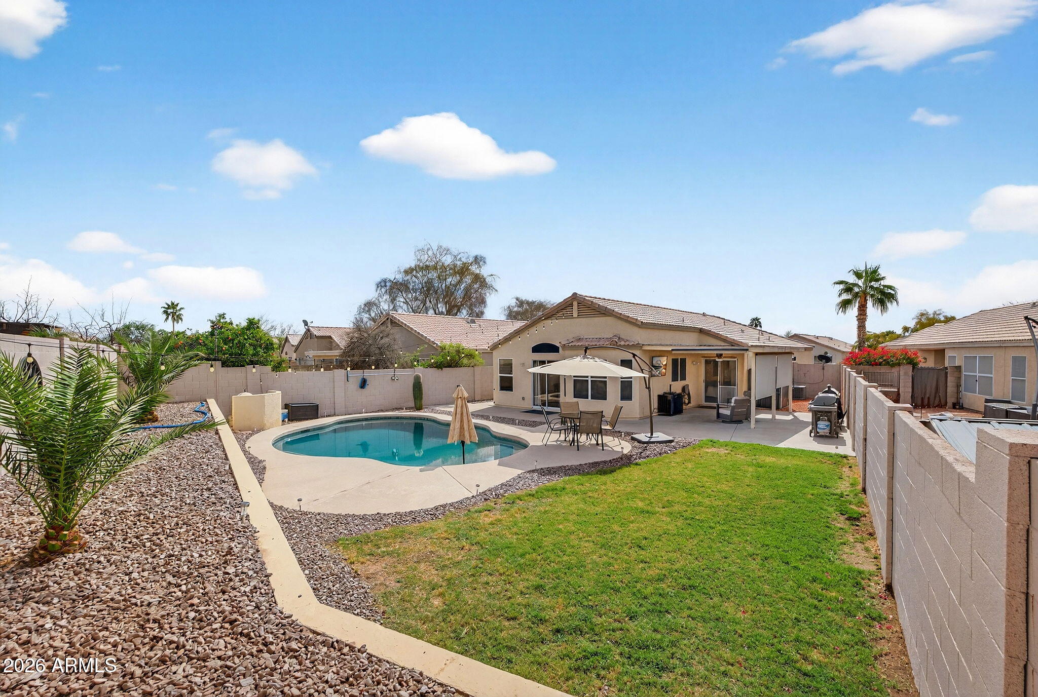 4630 East Dry Creek Road Phoenix, AZ 85044 - Photo 31 of 60 a view of a house with a yard and sitting area