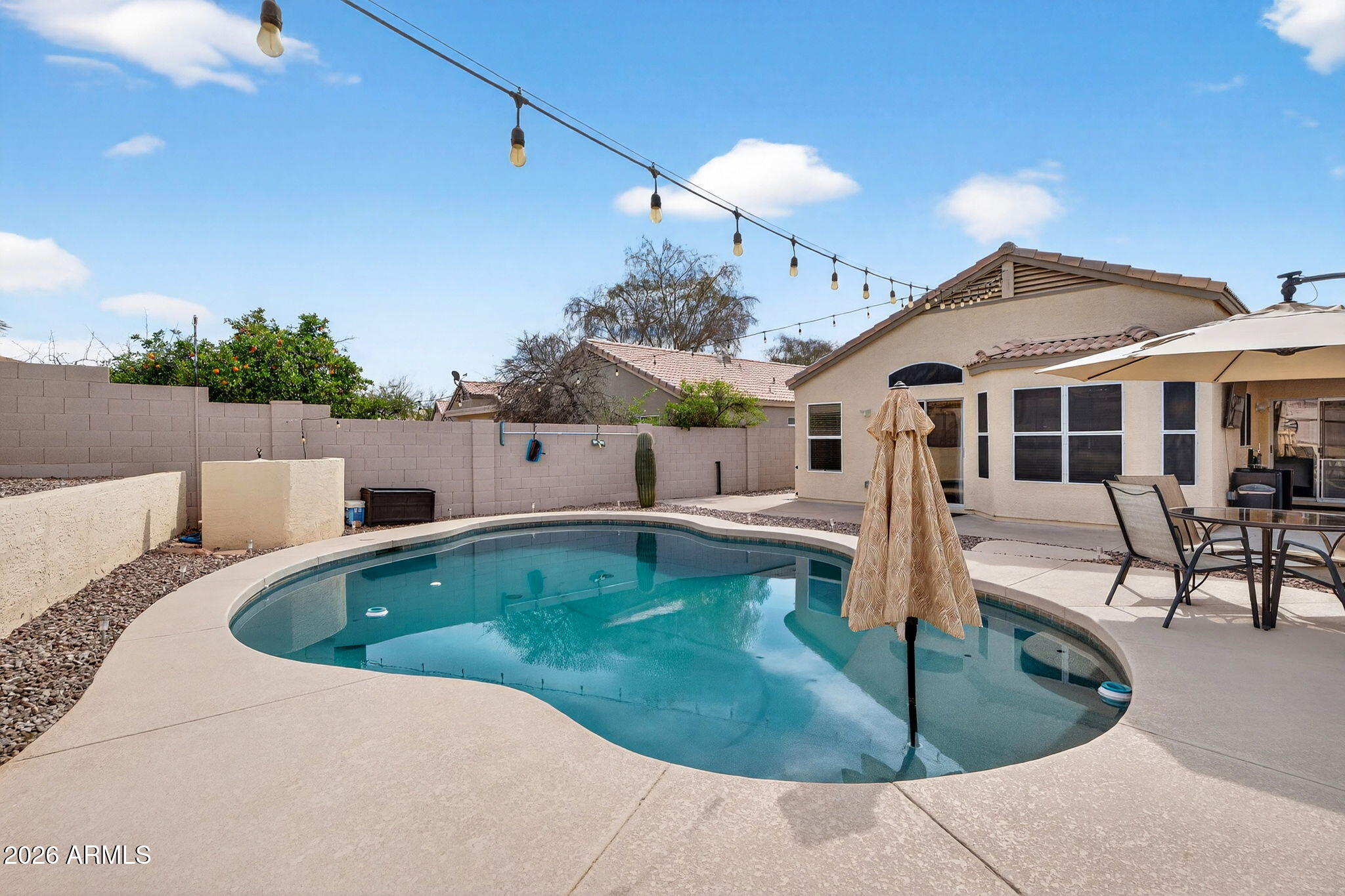 4630 East Dry Creek Road Phoenix, AZ 85044 - Photo 33 of 60 a swimming pool view with a outdoor seating