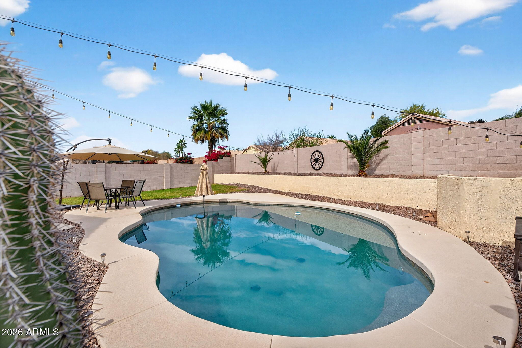 4630 East Dry Creek Road Phoenix, AZ 85044 - Photo 35 of 60 a view of a swimming pool with a patio
