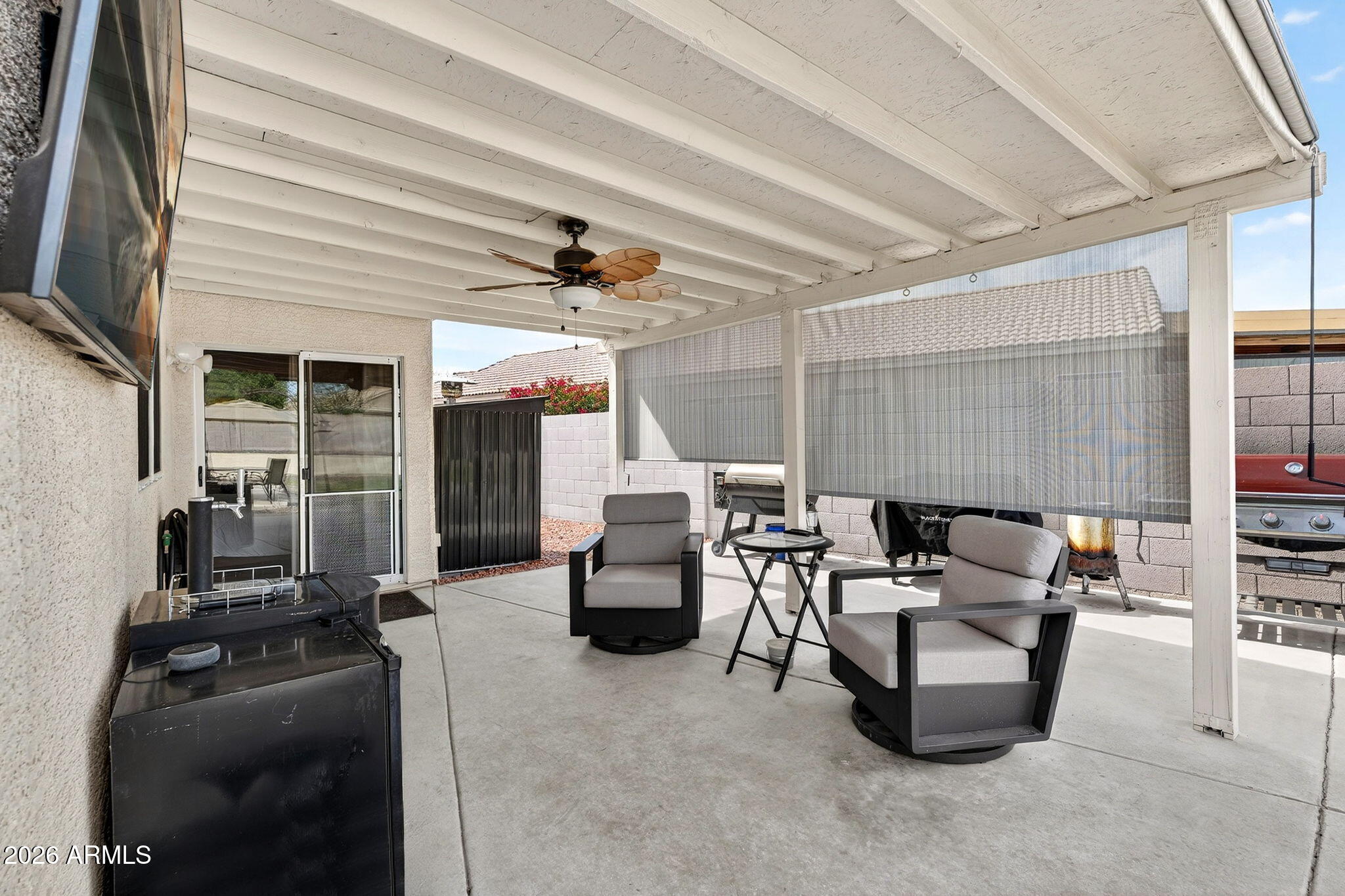 4630 East Dry Creek Road Phoenix, AZ 85044 - Photo 40 of 60 a living room with furniture and a flat screen tv