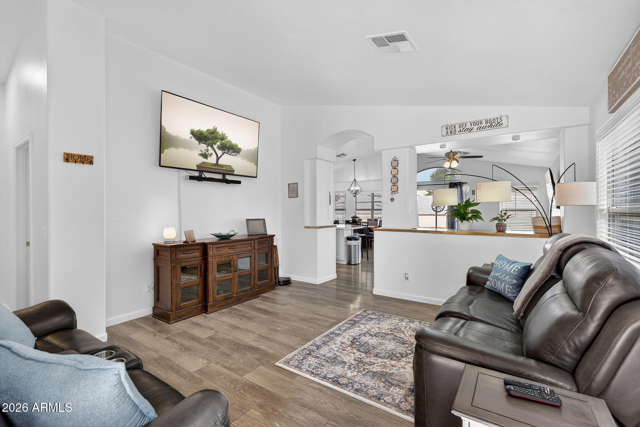 4630 East Dry Creek Road Phoenix, AZ 85044 - Photo 4 of 60 a living room with furniture and a flat screen tv