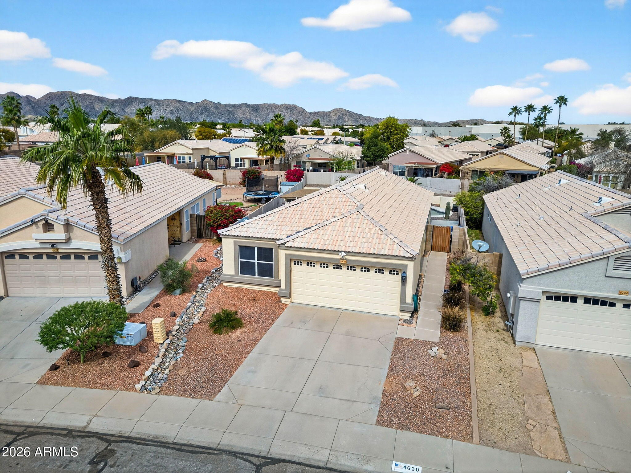 4630 East Dry Creek Road Phoenix, AZ 85044 - Photo 46 of 60 an aerial view of residential houses with outdoor space and parking