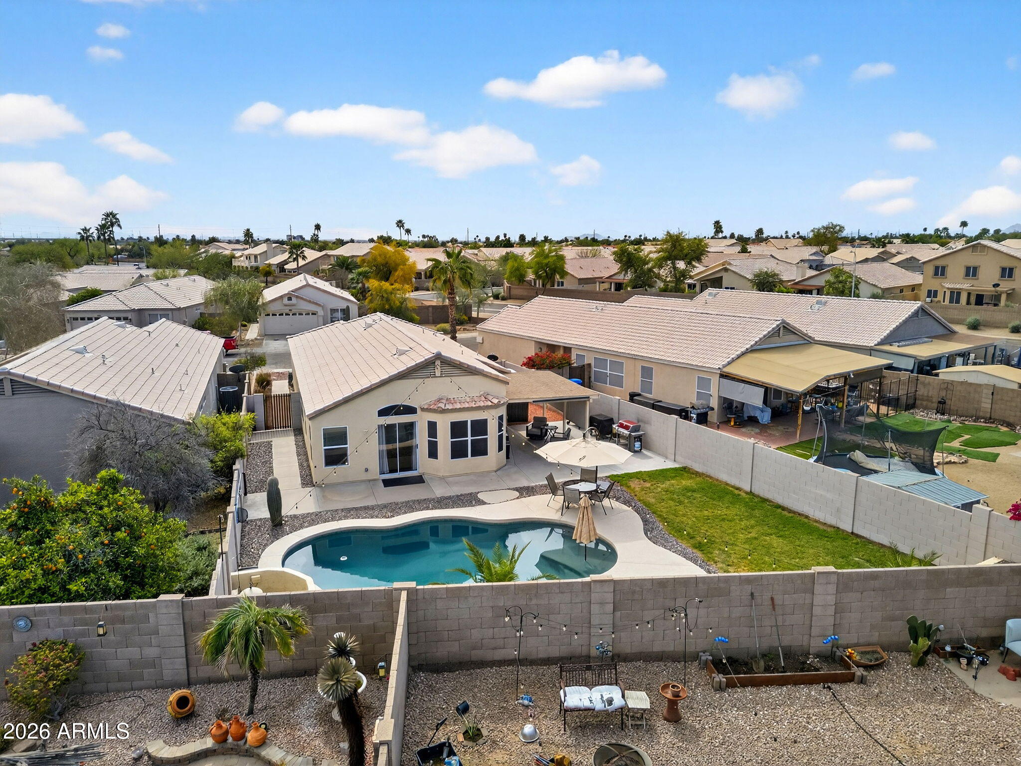 4630 East Dry Creek Road Phoenix, AZ 85044 - Photo 52 of 60 an aerial view of a house with a swimming pool