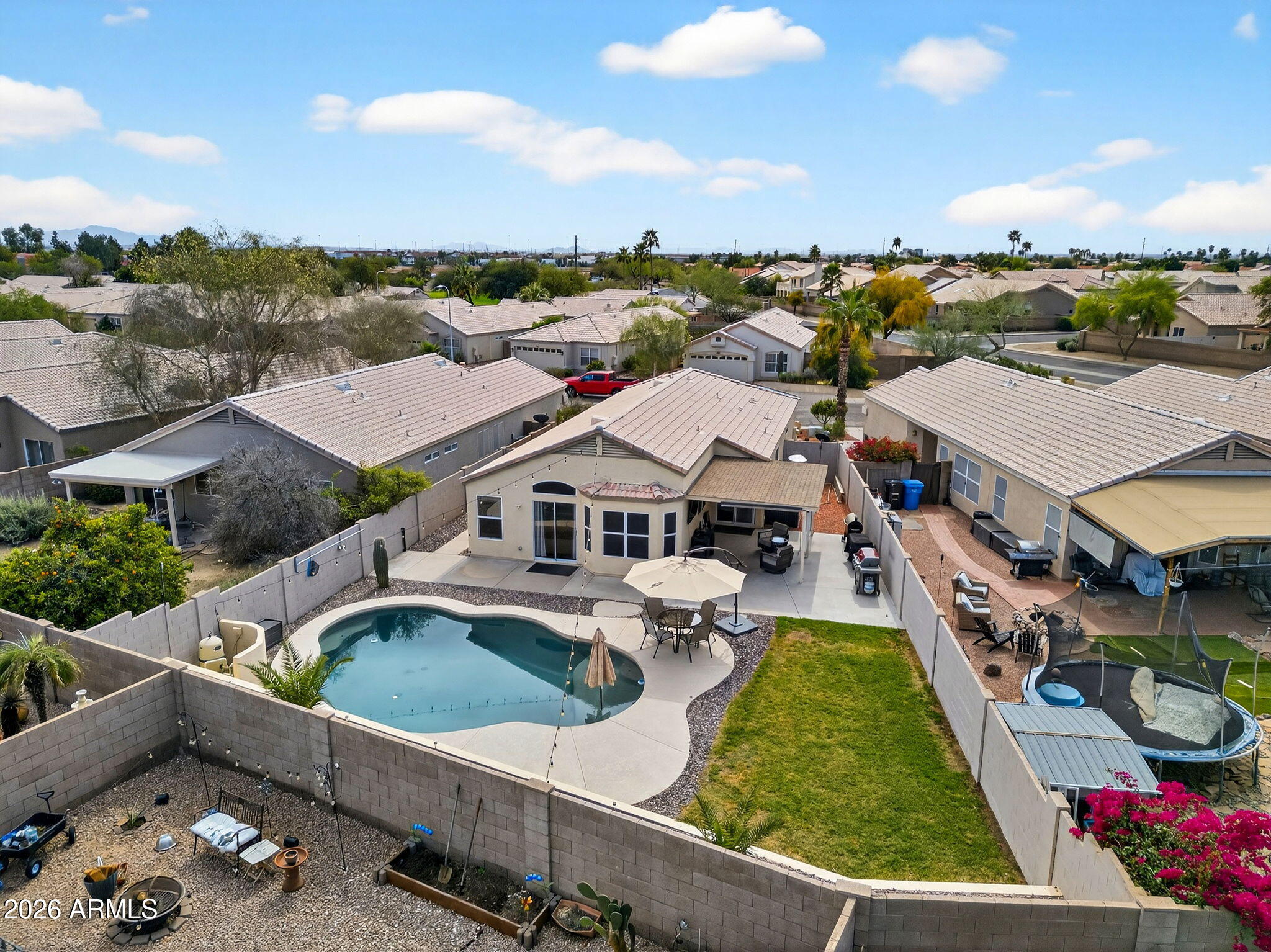 4630 East Dry Creek Road Phoenix, AZ 85044 - Photo 54 of 60 a view of a house with pool and chairs