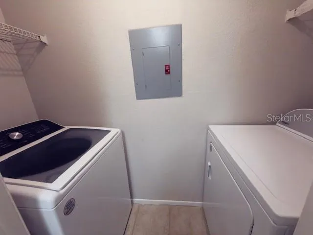 a utility room with dryer and washer