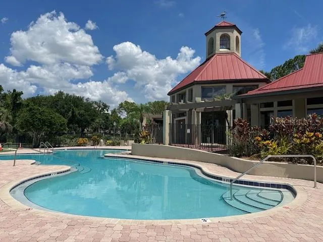a view of a two chairs in the garden